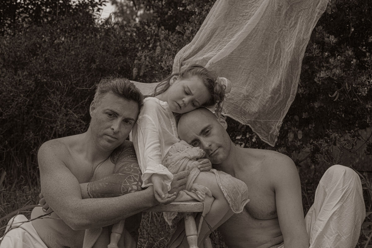 You are My Father by Angelika Kollin 

You are my Father series was a natural evolution and expansion of the preceding You are my Mother series and started unfolding in the second half of 2020. Since the main focus of Angelika’s artistic exploration were always women, taking a look into the world of manhood/fatherhood was a step into uncharted territory. Not having a close relationship with her own father, having an intimate and revealing insight into somebody else's Father/child connection, brought new insights and realizations, that turned out to be of great transforming power in her own life. As to the current date, all portraits for the series were taken in Cape Town, South Africa. Only like few other places, Cape Town offers one of the most unique melting pots, with people coming from a wide range of economic, cultural, and religious backgrounds. It was compelling to observe in this body of work how very same we all are in fundamental things of life: love for our children, the desire to give them a better life, and complete willingness to sacrifice your own for it.