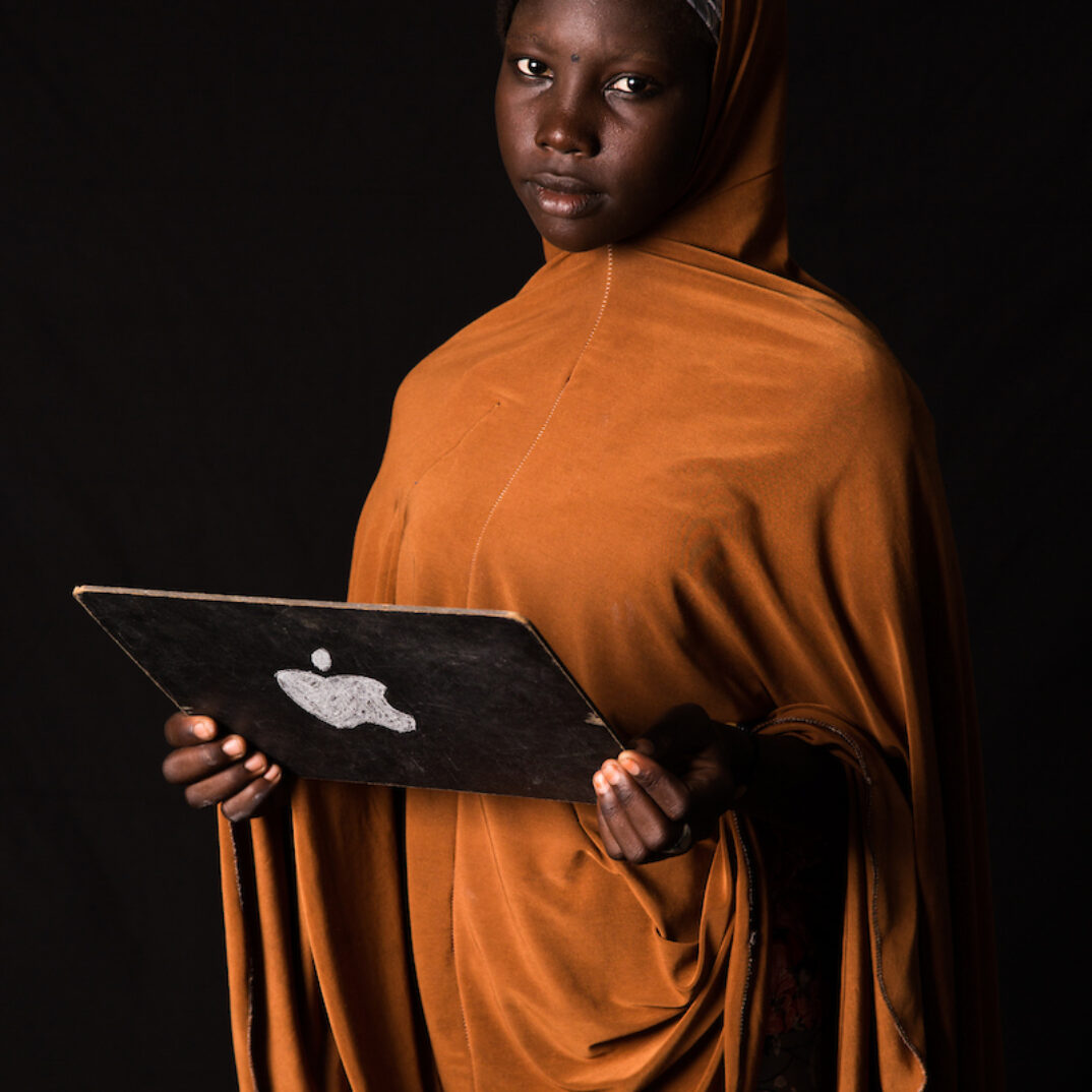 Khadija Kaku, 15, from Nigeria.

"I was born in a remote village in north-eastern Nigeria with no school and no clean drinking water. In 2010, there was another drought. We couldn’t harvest enough to live on for the rest of the year. We had to leave our home to travel to a village on the shores of Lake Chad. Feeling threatened by Boko Haram, we decided to leave our village in the hope of finding safety. We only spent 5 or 6 months there. One morning, men in turbans and dressed in black attacked the village, destroying everything in their path. We ran to the lake and jumped into a boat to flee to Chad. "

"I'd like to work in IT and new technologies. What I’ve learned is that with the internet, even if you don’t know something, somebody in the world has what you need. It’s the best way to learn and to share knowledge. My uncle had a television, a computer and a small shop where he charged people’s phones. This is where I developed a passion for new technologies. We watched Bollywood shows and music videos from all over Africa. Then we’d go out with friends and try to imitate the movies or the lyrics for fun.” 

Following Boko Haram attacks, many Nigerian took refuge in Chad.