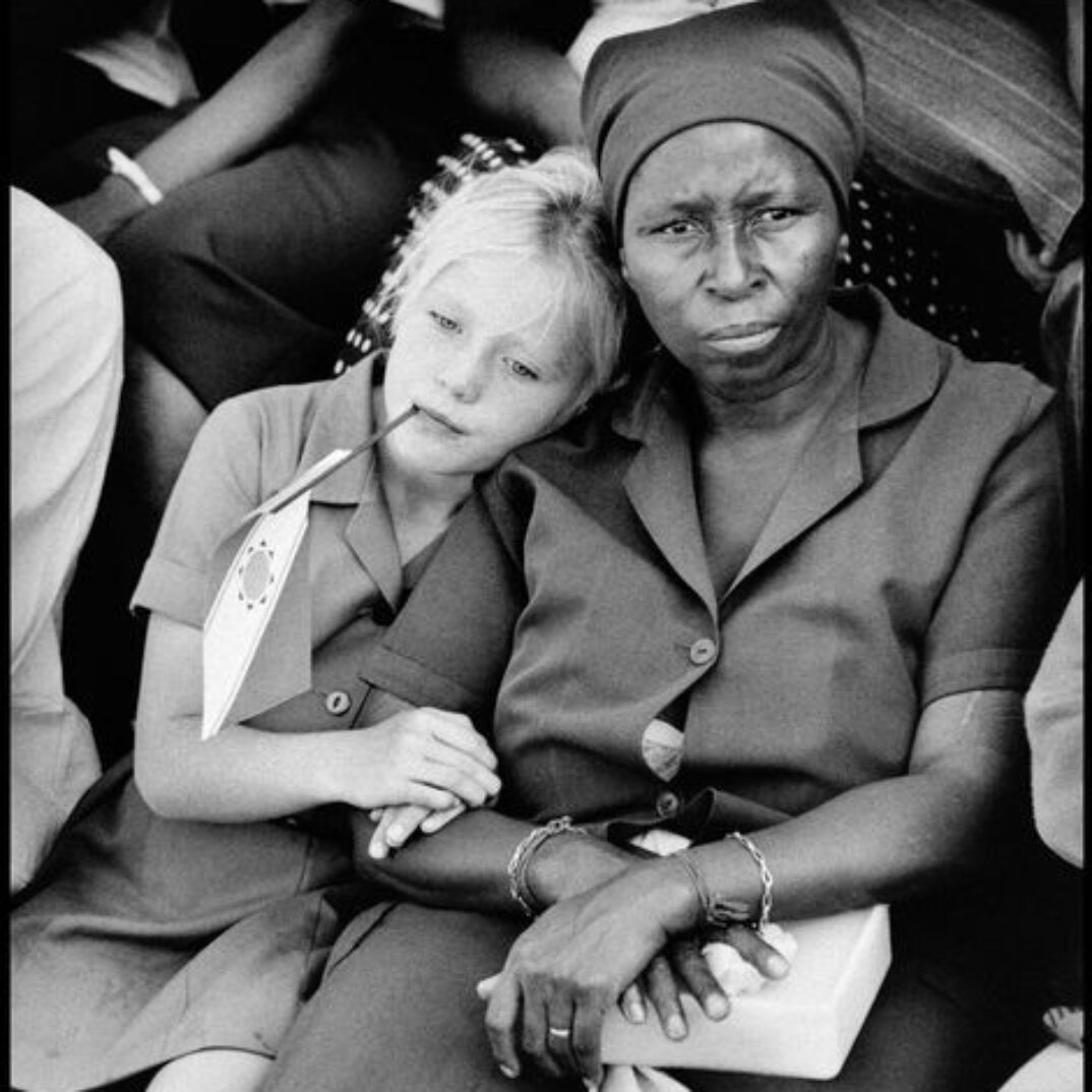 SOUTH AFRICA. Orange Free State. Harrismith. White child with black nanny at National Party meeting. 1994.